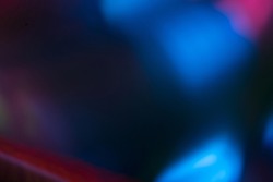 Color lens flare. Futuristic background. Blur fluorescent uv led illumination. Defocused neon blue pink light on dark abstract overlay.