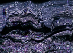 Futuristic glitch. Color digital noise. Matrix distortion. Nft art. Electronic defect. Purple blue static pixel artifacts fuzzy texture on dark black abstract background.
