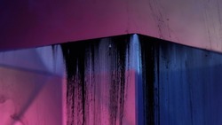 Black ink drip. Cyberpunk banner. Futuristic grunge. Neon pink blue color glowing transparent glass cube edge angle with liquid dirt waterfall geometric abstract background.