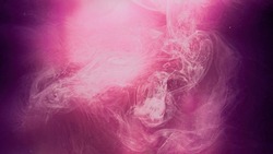Color mist cloud. Ink floating in water. Spiritual aura. Neon light pink purple glowing smoke haze flow abstract art copy space background.