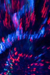 Blur neon sparks. Luminous light flare. Firework bang. Defocused navy blue red color blast glow curve strokes lines motion on dark night black abstract background.