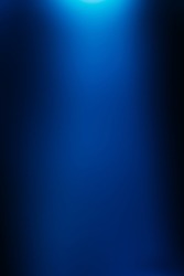 Defocused glow. Blur light leak. Sci-Fi illumination. Bokeh neon navy blue color gradient radiance flare on dark black futuristic presentation abstract copy space background.