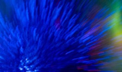 Blur neon glow. Bokeh light flare. Firework sparks. Defocused fluorescent navy blue explosion rays glare motion on rainbow colorful abstract background.