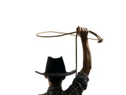 cowboy throws a lasso on the isolated background