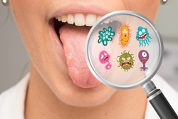Mouth germs and bacteria in magnifying glass