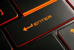 Shopping concept, Close-up laptop keyboard with orange light button ENTER.