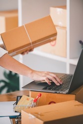 Small start-up business owners checking parcels at work, salespeople, checking production orders. Pack products for delivery to customers Sell ​​Ecommerce Shipping Ideas