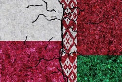 Poland and Belarus painted flags on a wall with grunge texture. Poland-Belarus conflict. Poland Belarus relations