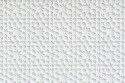 Close up of a white wall with Islamic pattern.