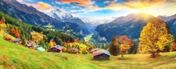 Fabulous autumn view of picturesque alpine Wengen village and Lauterbrunnen Valley with Jungfrau Mountain and  on background. Location: Wengen village, Berner Oberland, Switzerland, Europe.