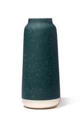 Subject shot of a ceramic sea-green matte vase with white dots and a light stripe at the bottom. The designer glaze vase with a starry sky pattern is isolated on the white background.