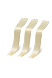 Close-up shot of a three straight clip-in strands (tresses) of hair. Blond clip in hair extensions. The strands are isolated on a white background. Side view.