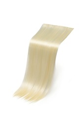 Close-up shot of a straight clip-in strands (tresses) of hair. Blond clip in hair extensions. The strands are isolated on a white background. Side view.