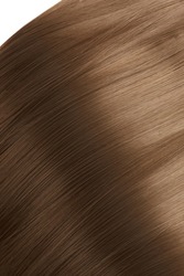 Close-up shot of a straight light brown clip-in strands (tresses) of hair. The strands are isolated on a white background. Top view.