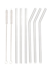 Close up shot of pack of six glass reusable straws. There are three straight straws and three curved straws, two cleaning brushes are isolated on white background. Front view.