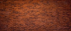 Panoramic Red Brick Wall Header Background. Vintage Brickwall Texture. Decorative Brick Wall in Room Interior. Loft concept. Beautiful Wide Angle Web banner or Wallpaper With Copy Space For Design
