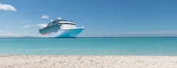 Summer vacation concept: Cruise ship on Caribbean Sea close to tropical beach.