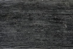 Old faded wooden texture of weathered black wood. Vintage rustic style. Natural surface, background and wallpaper.