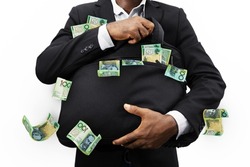 Businessman holding black bag full of 100 Australian dollar notes isolated on white background, money falling from bag
