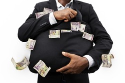 Businessman holding black bag full of 200 Namibian dollar notes isolated on white background, money falling from bag