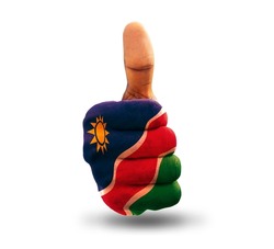 Thumbs up painted in Namibian flag colors isolated on white background. National flag of Namibia