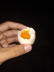 Delicious half-boiled egg cracked on top