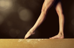 Close view of a Gymnast legs on a balance beam