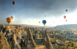 Hot air balloons above a gorgeous landscape
