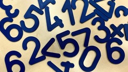 Plastic numbers and figures for the development of the child's intelligence, simple operations with numbers for education in childhood