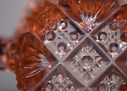 The pattern of 1930's, pink depression glass. 