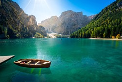 amazing view of braies lake with wooden boats on the water, surrounded by dolomites mountains. Trentino alto adige, Italy on the water, surrounded by dolomites mountains. Trentino alto adige, Italy