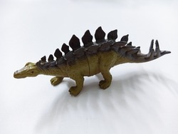 Stegosaurus dinosaur Toy Figure. Plastic dinosaur toy isolated on white background. Stegosaurus is a genus of herbivorous, four-legged, armored dinosaur
