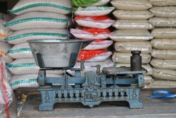 Rice scale in Indonesian traditional market. Old style metal scale.
