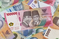 pile of rupiah banknotes, top view photo