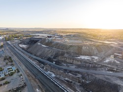 Early morning high angle aerial drone view of a big open pit silver, zinc and lead mine (orebody called line of lode) and a miner’s memorial and visitors centre located in Broken Hill, New South Wales