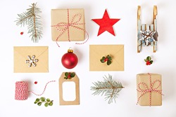 Christmas composition. Christmas gifts with envelopes and decoration on white background. Top view, flat lay, copy space