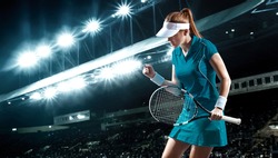 Tennis player with racket. Woman athlete celebrating victory on grand arena background after good play.