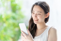 attractive japanese woman using smart phone