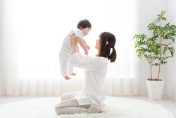 portrait of asian mother and baby in the room