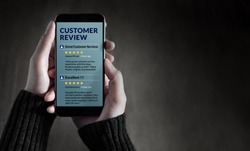 Customer Experience and Online Review Concept. Female holding SmartPhone to Reading Customer Review before Buying Products