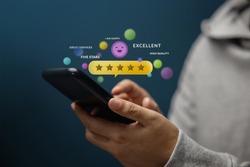 Customer Experiences Concept. Happy Client Using Smartphone to Review Five Star Rating for Online Satisfaction Surveys. Positive Feedback on Mobile Phone