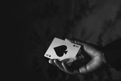 Ace Spade Card in Hand, Low-key lighting