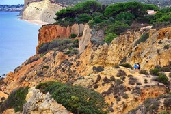 Lagos, Algarve, Portugal, Europe - GeologicaL - landscape trail of Ponta da Piedade for walks and cycling only, unique geological formations, fauna and flora, Porto de Mos beach in background