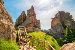 High rocks in the Carpathian mountains, nature landscape, ruins of Tustan fortress.