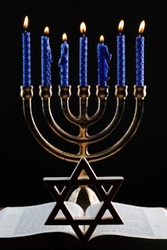 Open Torah, star of David  and the menorah or seven-lamp Hebrew lampstand, symbol of Judaism since ancient times. 