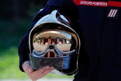 Fire department.  Firefighter and helmet. French Sapeurs Pompiers. France. 