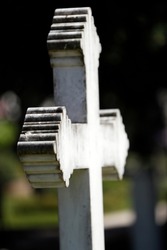 Cemetery of the Kings. White stone cross on grave. Geneva. Switzerland.