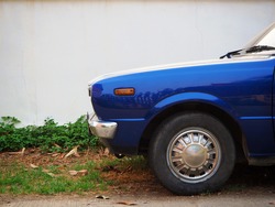 Old retro or vintage car or automobile front side