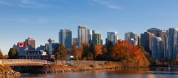 Downtown Vancouver Canada modern city panorama view Coal Harbor business district area high office and apartment buildings with Naval Museum at HMCS Naval Reserve with a large Canadian flag