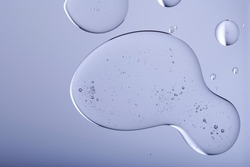Blob with bubbles and clear formulation on a transparent background. Clear liquid with bubbles resembling glycerin, hyaluronic acid or keratin in laboratory or scientific setting.